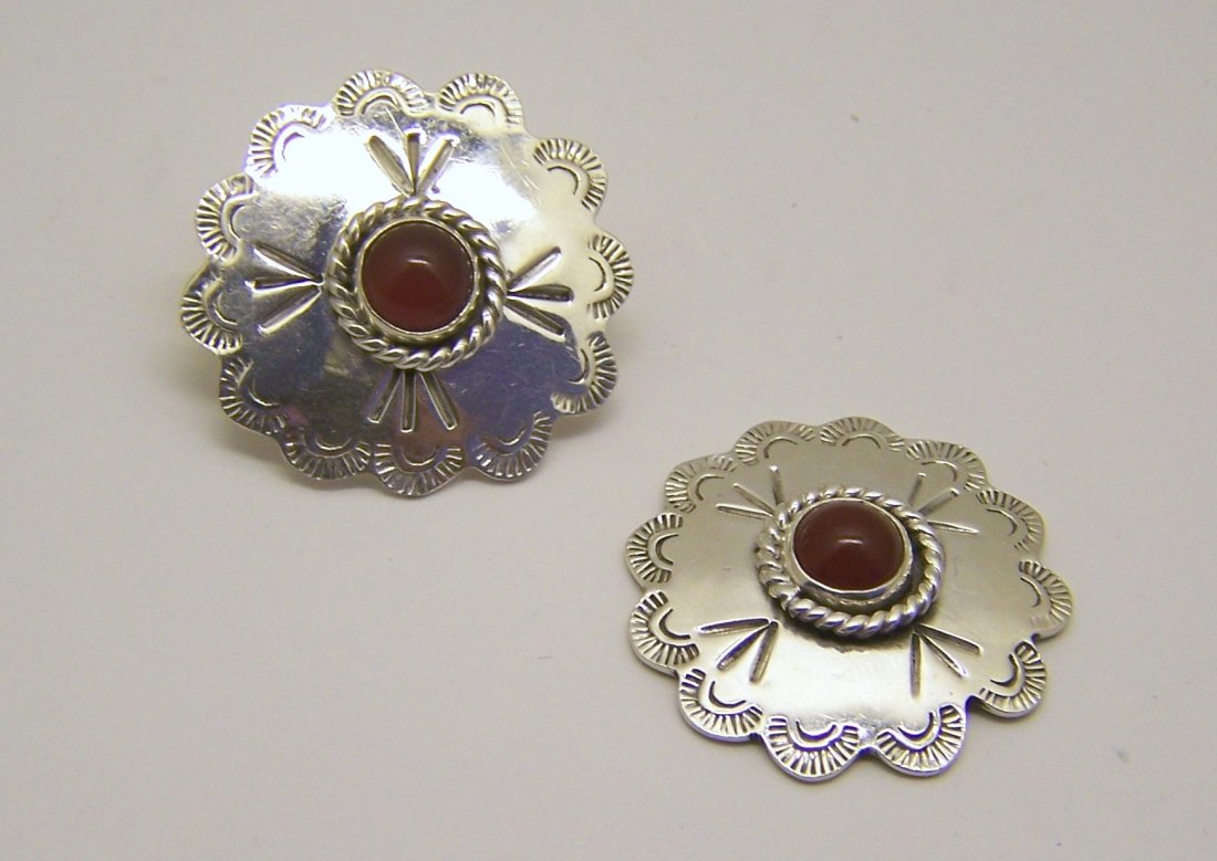 Mexican sterling silver carnelian earrings: measures 1 3/16" in diameter, weights 17.2 grams, in good condition, one of the earrings need the to be fix on the post
