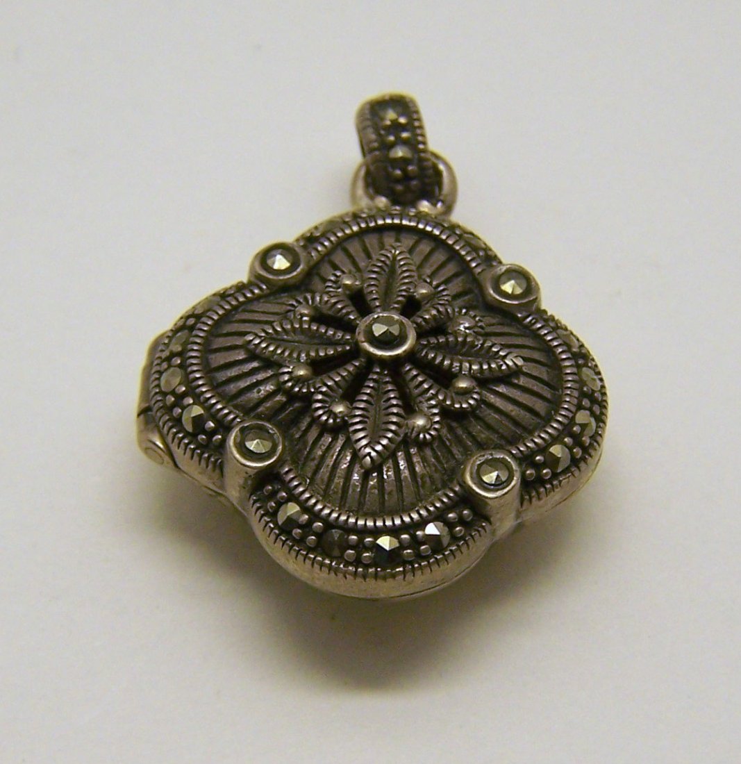 vintage sterling silver marcasite locket pendant: measures 1 1/4" long by 15/16" wide, weights 10.6 grams, in great condition