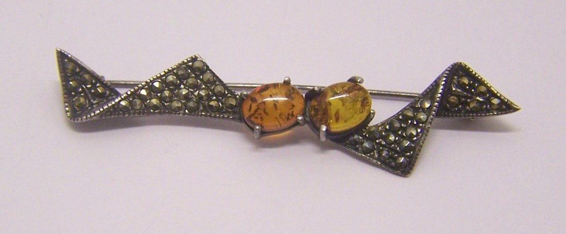 TM sterling silver marcasite amber brooch pin: measures 2 3/8" long by 9/16" wide, weigts 4.8 grams, in good condition