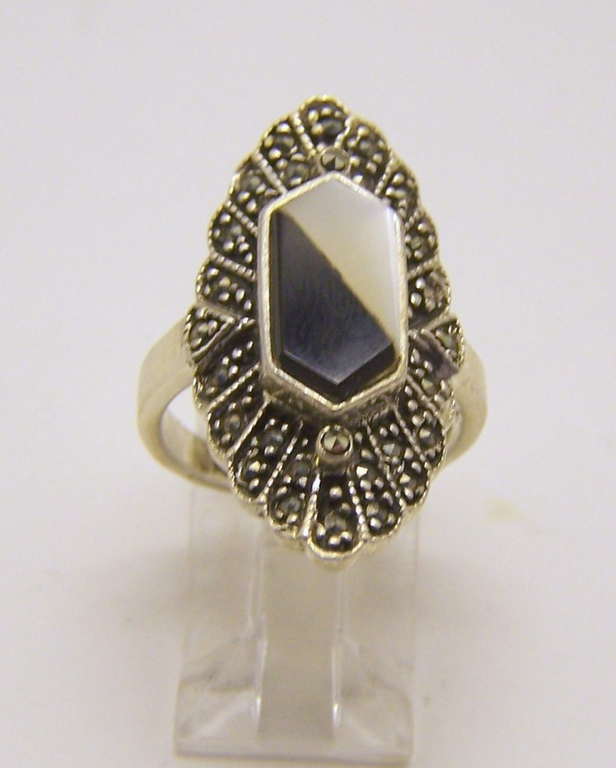 sterling silver marcasite onyx ring: top of the ring measures 1 3/16" wide, size 7, weights 6.5 grams, in good condition