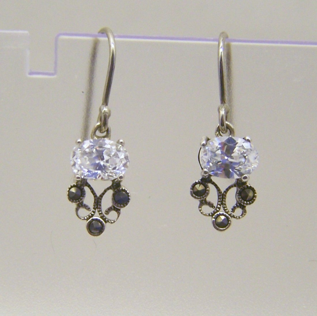 sterling silver cz marcasite earrings: measures 15/16" long by 5/16" wide, weights 2.4 grams, in good condition