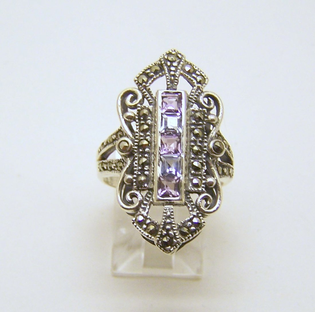 sterling silver topaz marcasite amethtyst ring: top of the ring measures 1 1/8" wide, size 7, weights 5.5 grams, in good condition