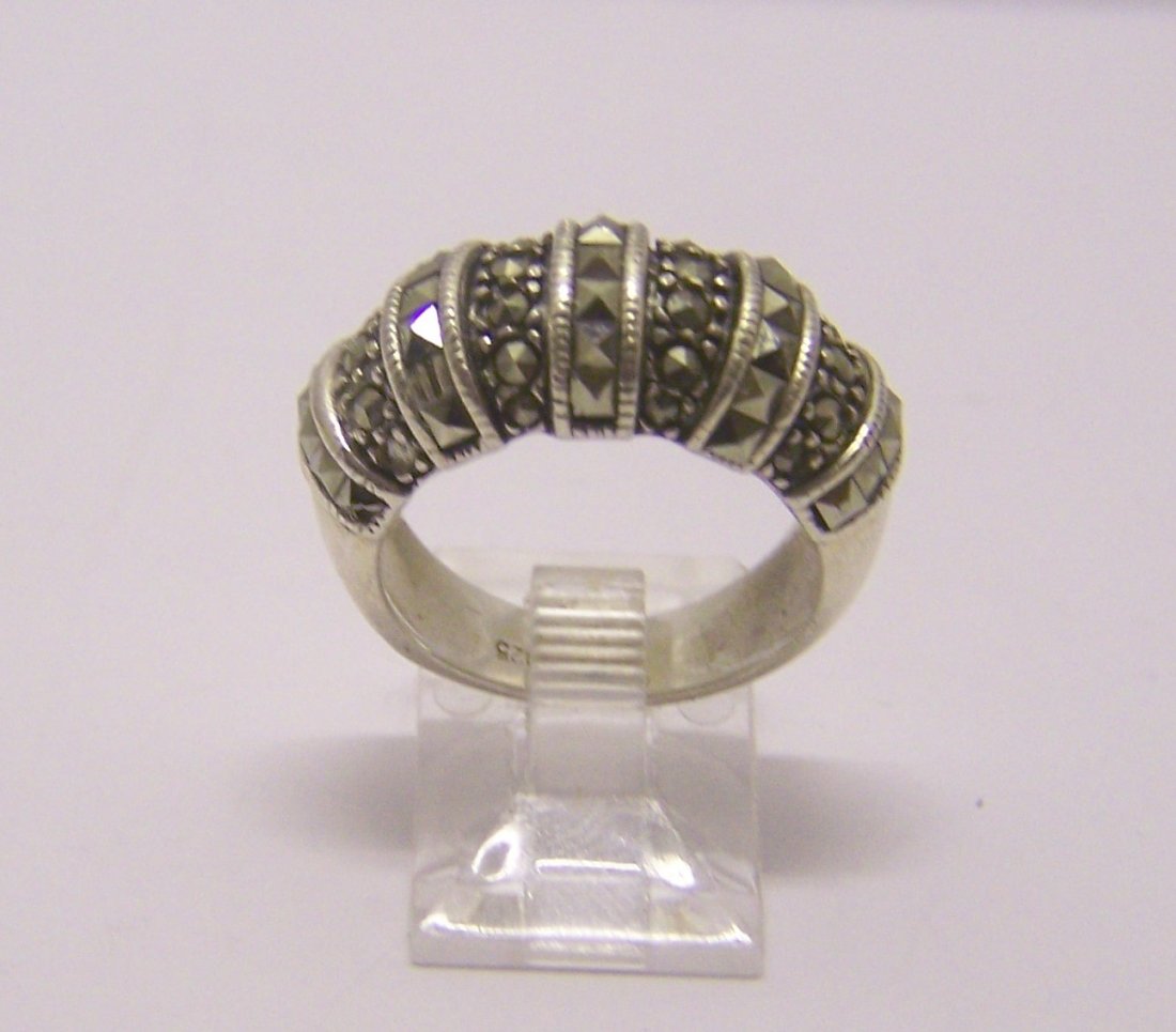 sterling silver marcasite ring: top of the ring measures 3/8" wide, size 6 1/2, weights 7.4 grams, in good condition