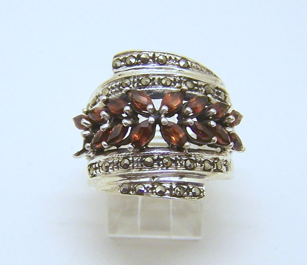 WS sterling silver garnet marcasite ring: top of the ring measures 7/8" wide, size 8, weights 7.9 grams, in good condition