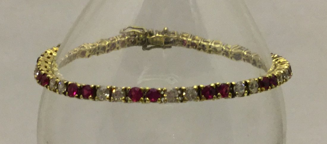 sterling silver ruby sapphire bracelet: measures 7 1/8" long by 1/8" wide, in good condition