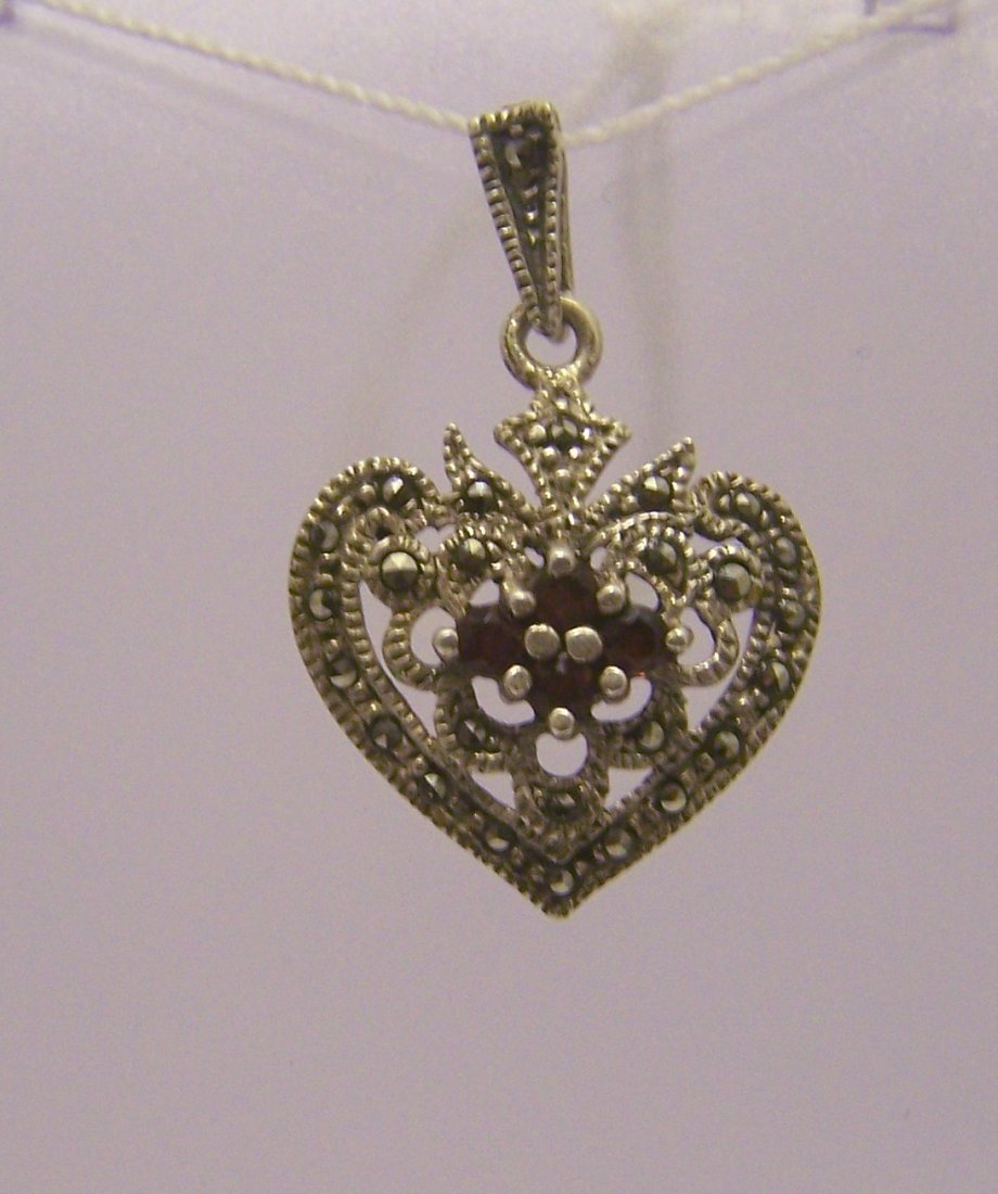 sterling silver marcasite garnet pendant: measures 1 1/4" long by 13/16" wide, weights 3.5 grams, in good condition