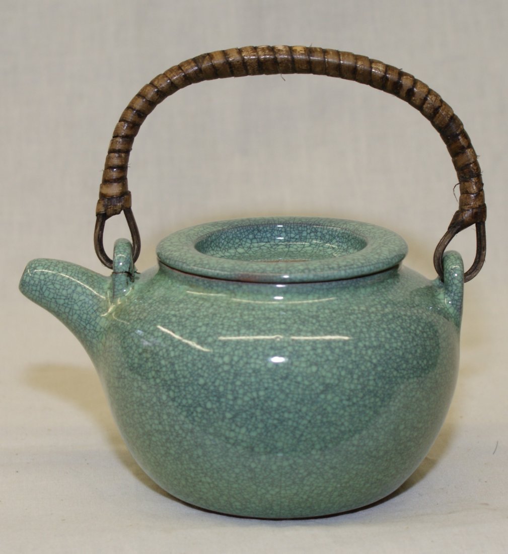 Zisha teapot covered with porcelain.: Zisha teapot covered with porcelain. Qing Kangxi Mark. Width 5 1/2 inches (14 cm.)