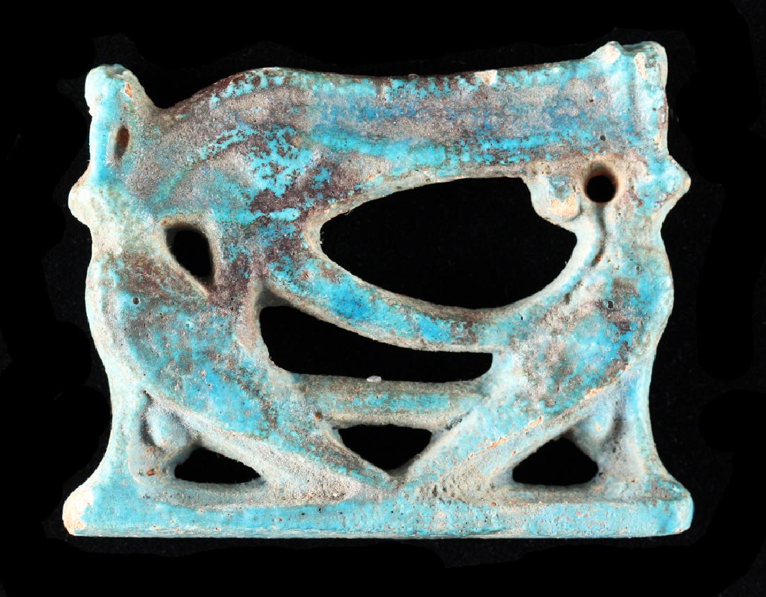 Egyptian Faience Eye Of Horus Pendant: An Egyptian symbol of protection. H: 1 3/4, W: 2 1/4 inches.
