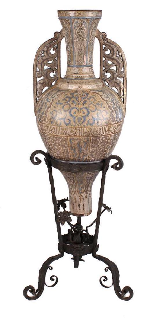 Continental 19th C. EarthenwareCopper Luster & Blue: Continental earthenware copper luster and blue Alhambra amphora vase on a wrought iron tripod stand. Possibly Theodore Deck or Samson. Modeled after the 'Alhambra Gazelle Vase'. Shipping weight: 67 lb
