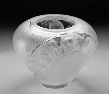 Lalique Crystal Ceylan Vase: Mark hand etched into base: Lalique @ France. With original box. In 1995 Marie-Claude Lalique designed two large vases featuring a parade of elephants. Borneo is a tall vase and Ceylan is a similar de