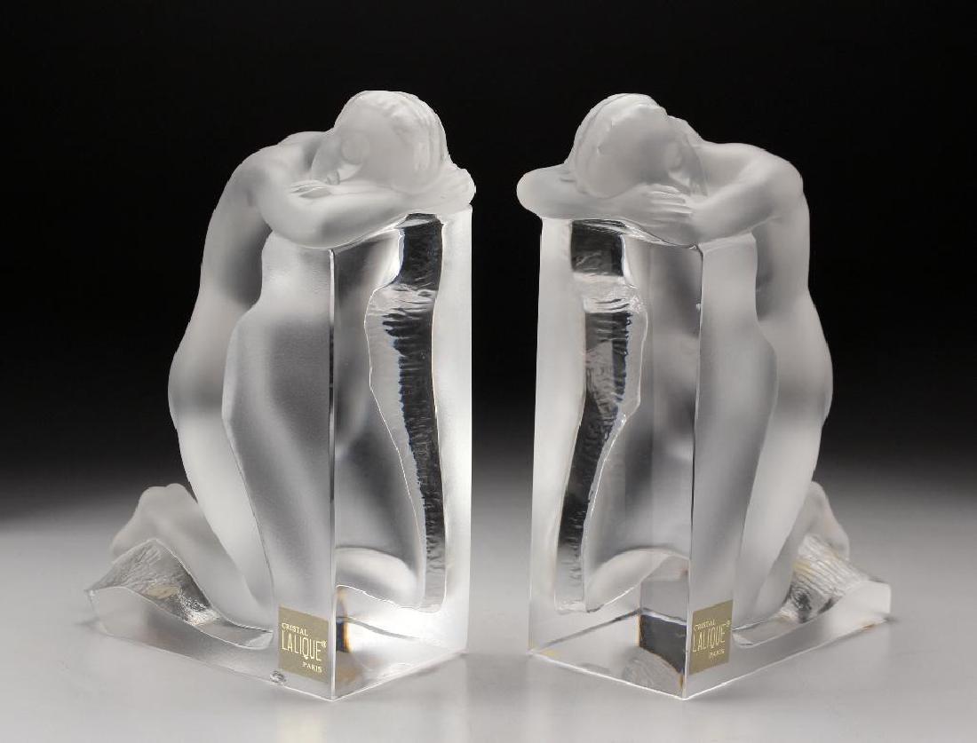 Lalique Clear & Crystal "REVERIE" Nude Bookends: Lalique Clear & Crystal "REVERIE" Nude Bookends #11850. Designed by Marie Claude Lalique. One with original paper Made in France label. Original sticker Crystal Lalique Paris. Condition: Two