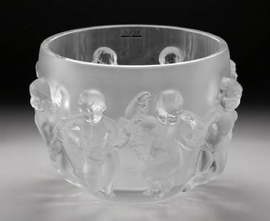 Large Lalique Luxembourg Cherub Crystal Center Bowl: Large Lalique crystal center bowl in the "Luxembourg" pattern, depicting eight cherub figures in relief. Signed on the base "Lalique France". Original LALIQUE FRANCE, label interior rim. Star mark on