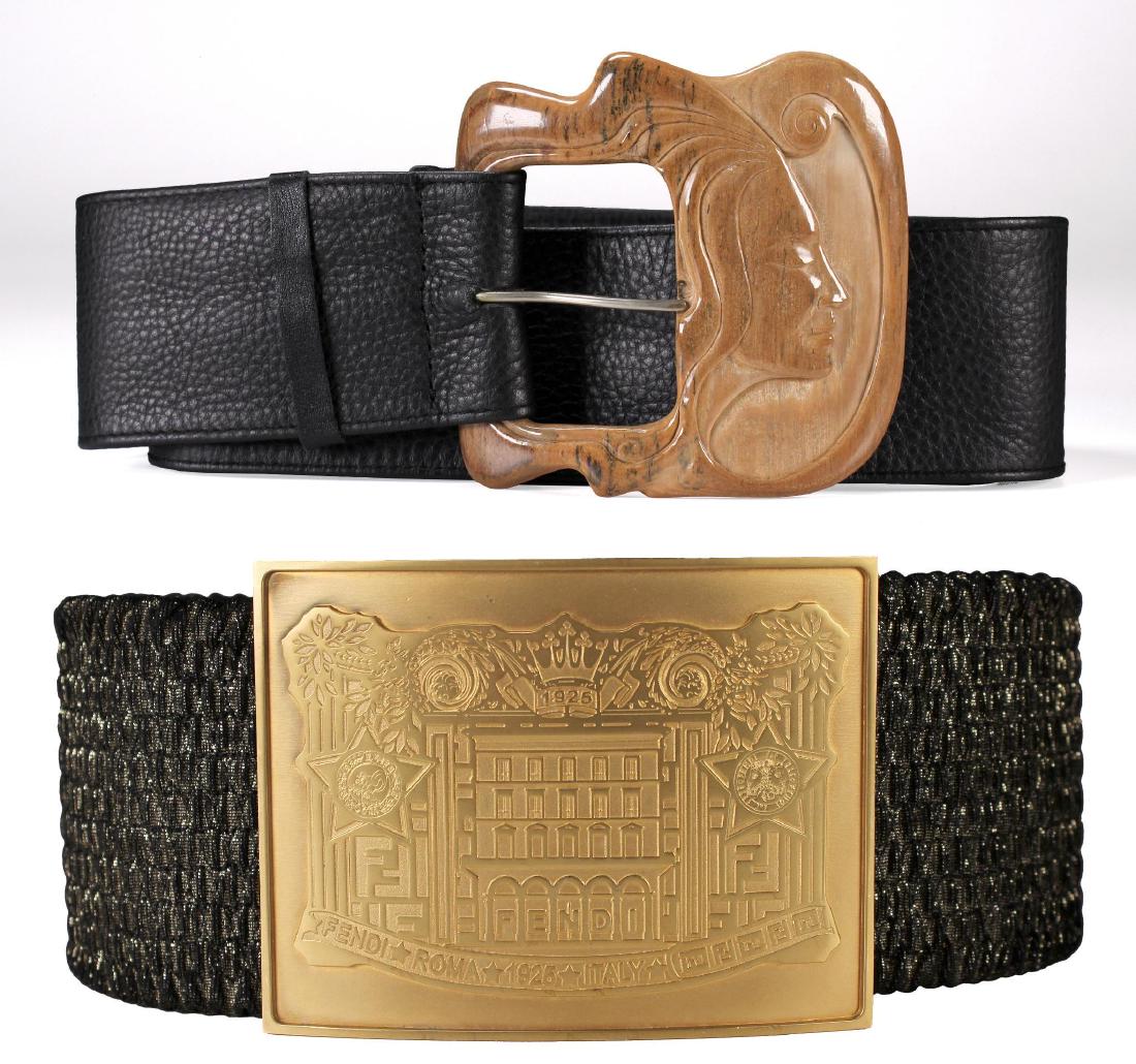 A Italain Fendi Belt and Another: Fendi Italian buckle dimensions: Buckle 3 5/8 x 5; Length: 35 1/2 inches. Carved wood belt Buckle: Buckle: 4 x 4; Length: 46 inches. Dated 86. Weight: 1 lb.