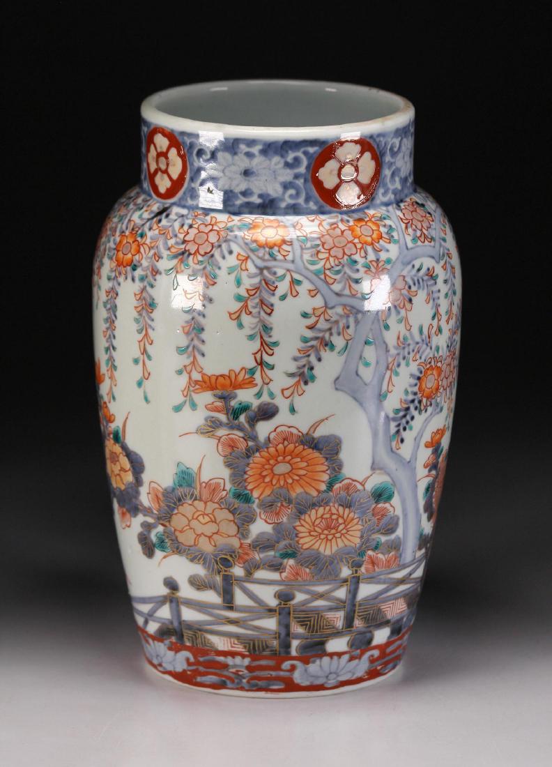 Japanese 19th C. Imari Porcelain Pot: Marked on the base in iron red with a censer symbol. Height: 9 5/8 inches. Weight: 2 1/2 lbs. Condition: Spider hairline to base.