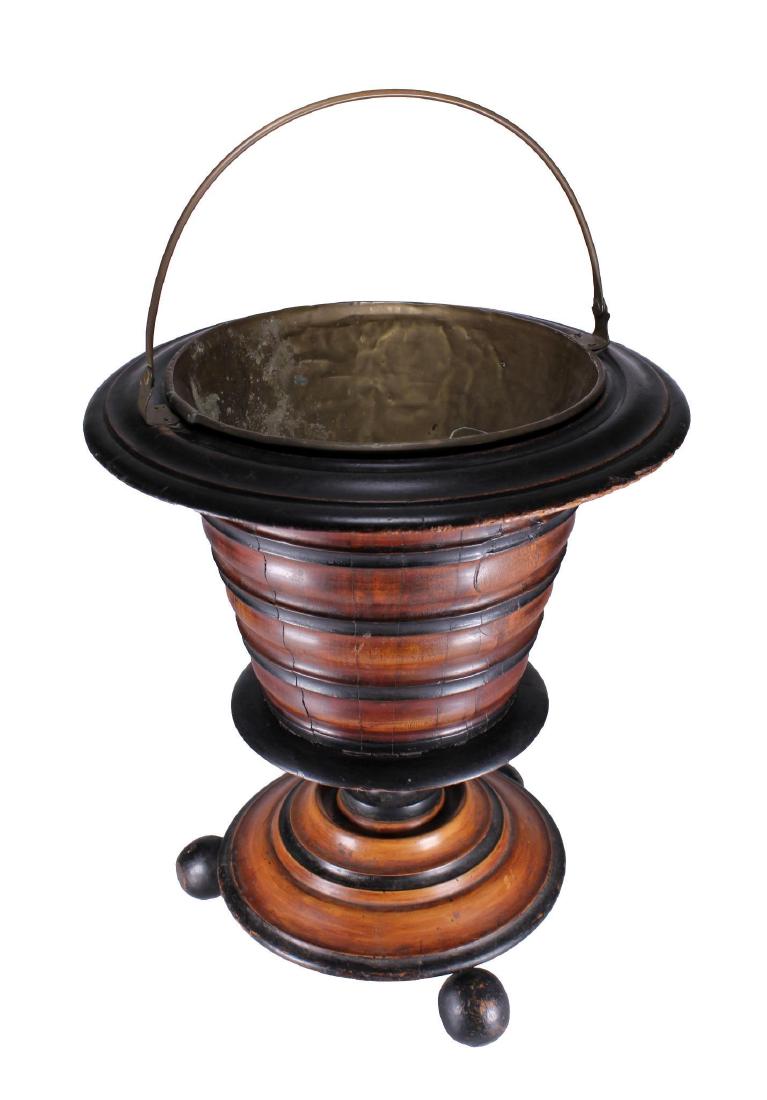 Dutch 18th/19th C. Ebonized Fruitwood Coal Bucket: The pedestal coal bucket supported on ball feet with a hinged handle and brass liner of turned ebonized and fruit wood construction. Height: 16 3/4 inches. Weight: 7 lbs. Condition: Brass liner with o