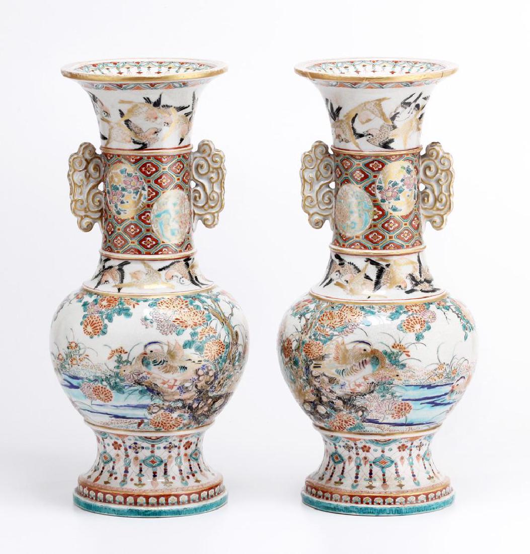 Pair of Japanese Satsuma Earthen Ware Vases: Pair of Satsuma vases decorated with ducks among foliage below two circling bands of flying swallows, double handles Shipping weight: 11 lbs 12 oz