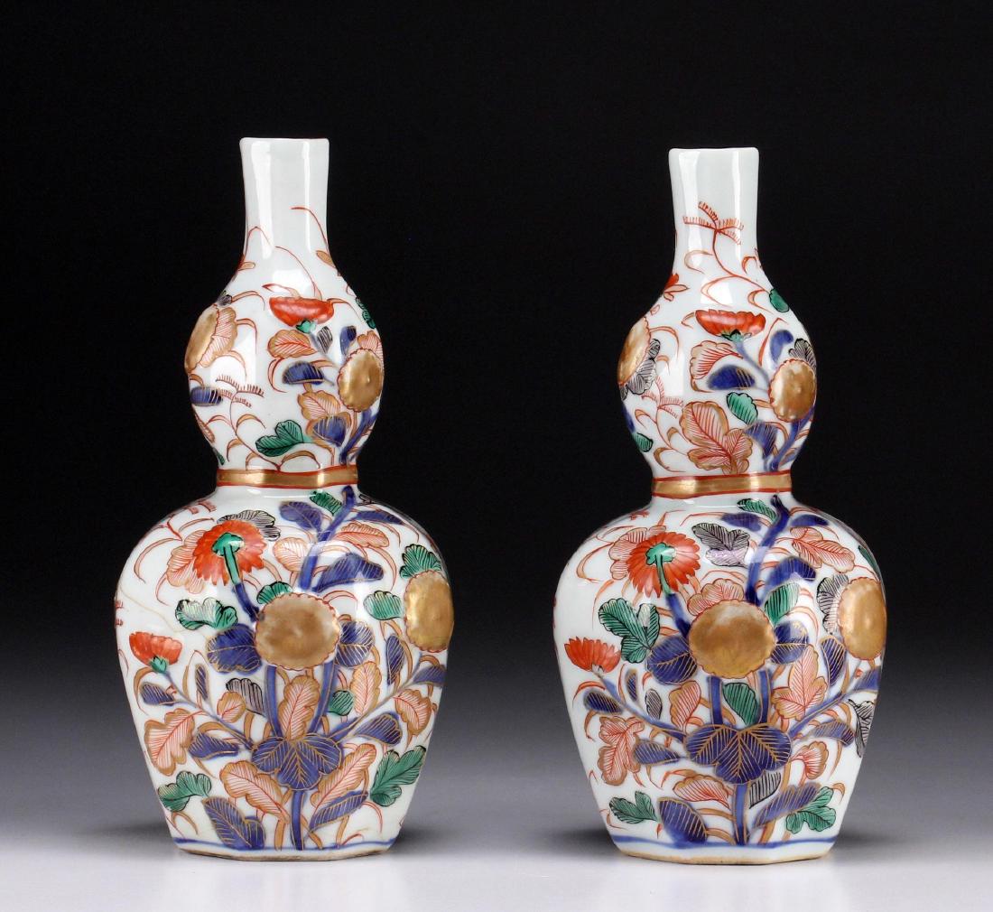 Pair of Japanese Edo Period Porcelain Vases: Condition: One restored and one crescent hairline to lip. Height: 6 1/2 inches. Weight: 1 lb. Circa: 1800