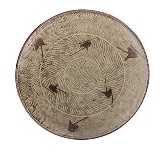 Tatsuzo Shimaoka (Japanese 1919-2007) Stoneware Pottery: Stoneware dish by Tatsuzo Shimaoka featuring rope impressed inlay design (???jomon zogon???) and having a decorative motif of iron oxide overglaze designs. Diameter: 12 inches. CONDITION