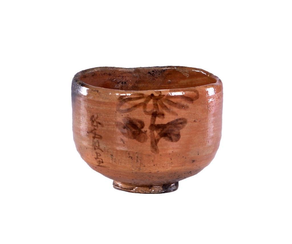 Japanese Edo Perod Glazed Raku Ceramic Tea bowl: The early raku type tea bowl (chawan) with floral decoration in inscription and gilt lacquer repair (kintsukuroi) to the side. Height: 3 1/4 inches Diameter: 4 1/2 inches Weight: 1 lb.