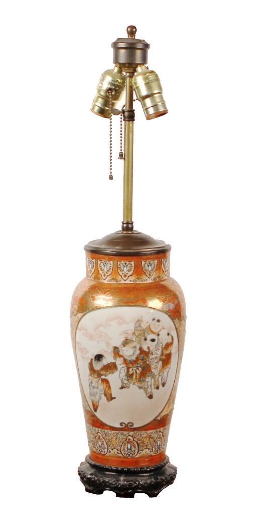 Japanese Meiji Period Kutani Porcealin Vase as a Lamp: The Kutani porcelain vase with depictions of boys at play on one side and pair of peacock on the other. Height: 25 inches. Base: 13 1/4 inches. Weight: 7 lbs. Condition: Good.