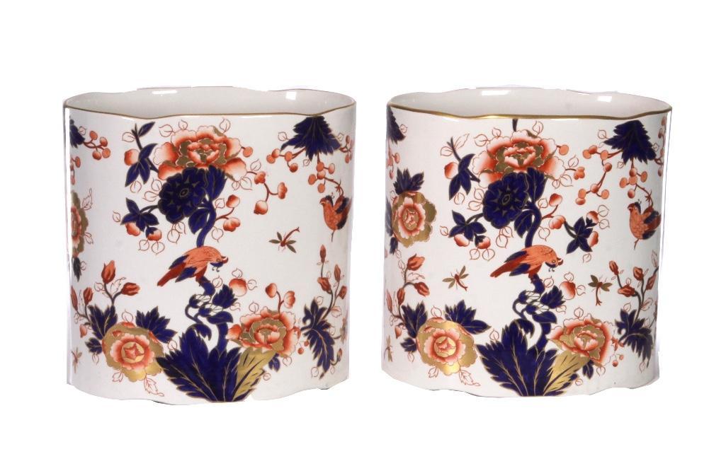 Pair of English Coalport Porcelain Ovoid Containers: Pair of ovoid porcelain pieces produced by Coalport, Shropshire, England, in the Hong Kong pattern. Height: 10 inches. Width: 10 inches. Depth: 6 3/4 inches. Weight: 12 lbs. Condition: Restoration on 