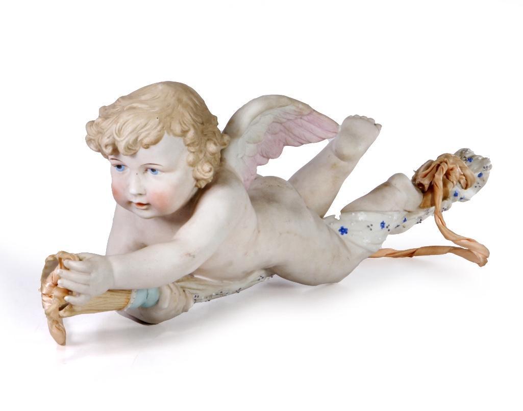 German Bisque Putto: Length: 18 inches Weight: 2 1/2 lbs. Condition: With crack on back.