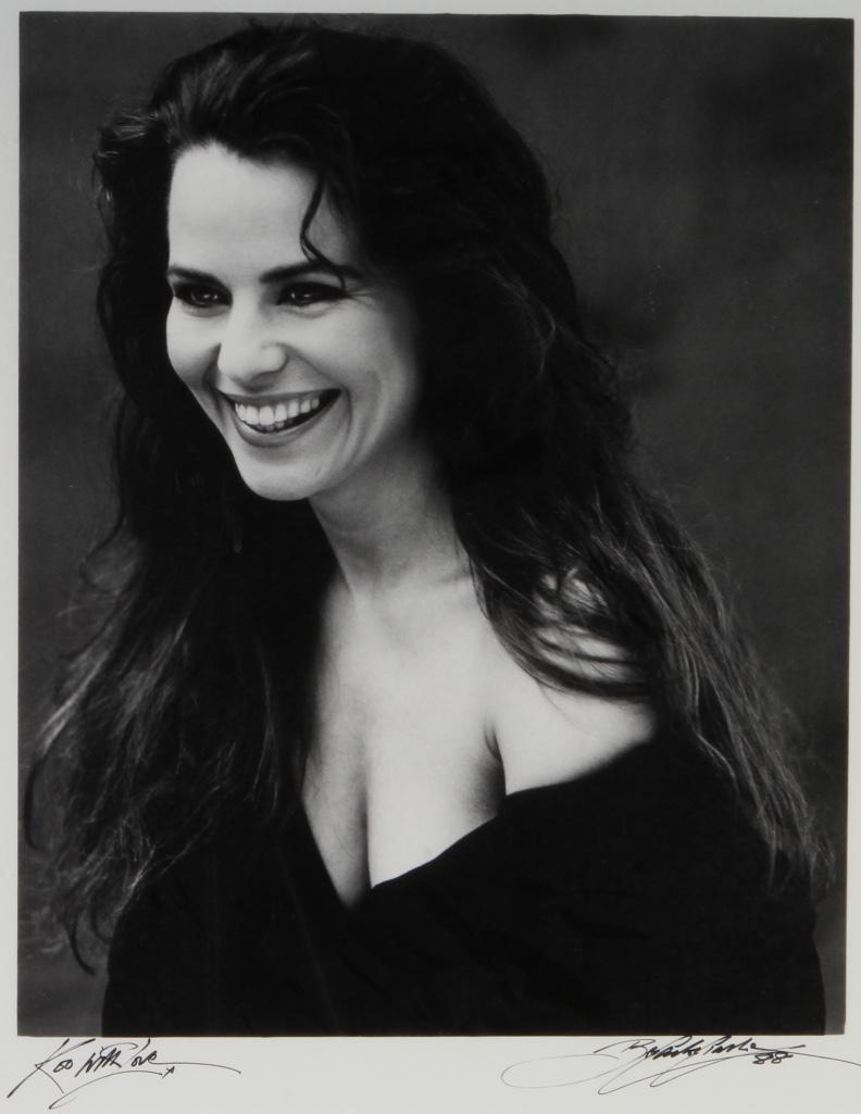 Black and White Portrait, Koo Stark: Framed, under glass. Signed by model and artist on lower corners. Dated 1988. Frame: 28 1/4 x 23 1/4 inches Sight: 19 x 5 inches Condition: Good. Provenance: Koo Stark