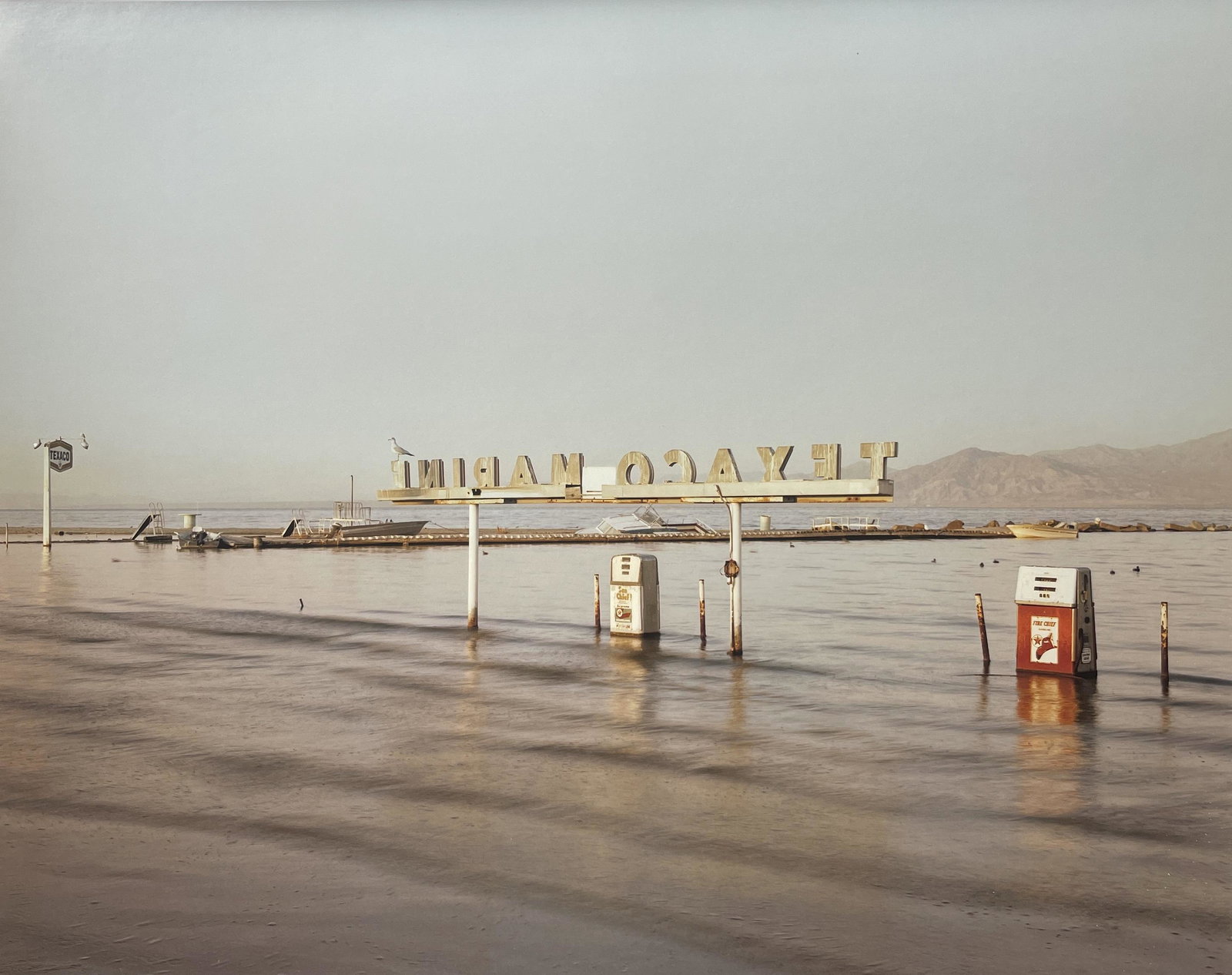 Richard Misrach "Flooded Marina, Salton Sea, 1983" Print: Richard Misrach "Flooded Marina, Salton Sea, 1983" Print. Measures 11.1 x 14.1. Mounted to Archival Quality Paper. Verso is blank. Printed circa 2000's.