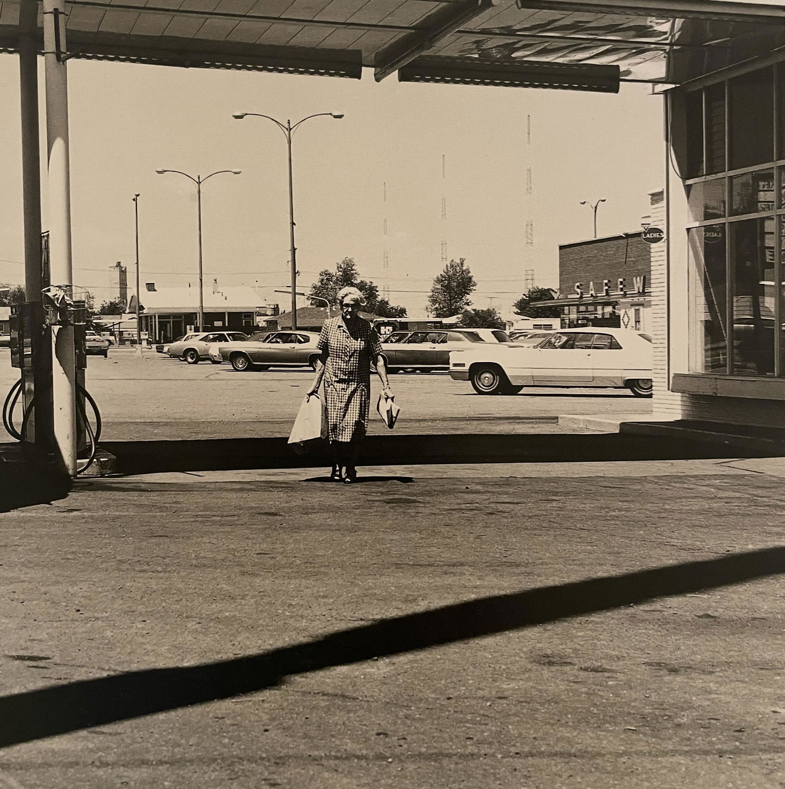 Robert Adams "Federal Boulevard, Denver" Print: Robert Adams "Federal Boulevard, Denver" Print. Measures 6 x 5.75. Mounted to Archival Quality Paper. Verso is blank. Printed circa 1970's.