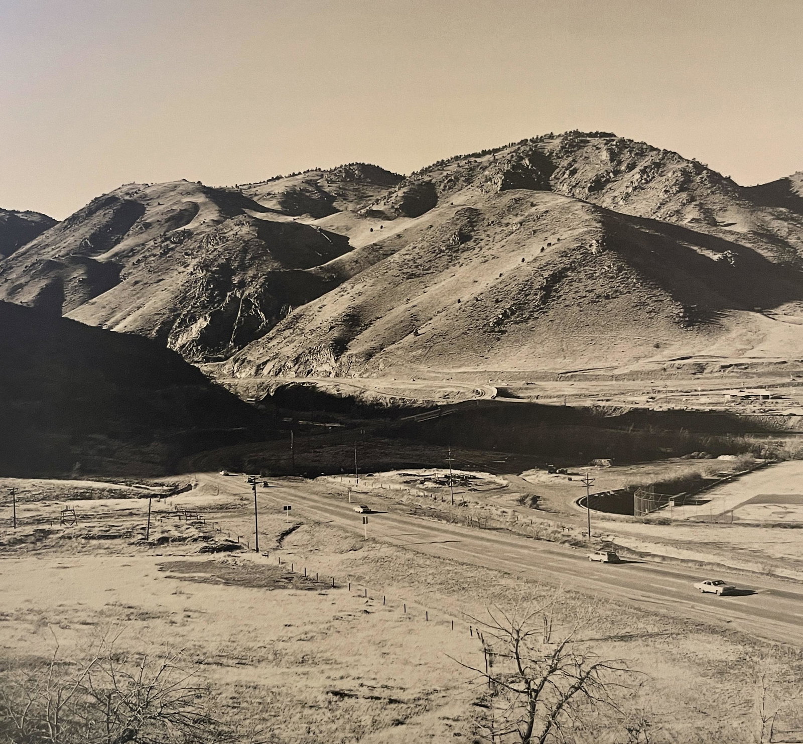 Robert Adams "Zufahrt zum Clear Creek Canyon" Print: Robert Adams "Zufahrt zum Clear Creek Canyon" Print. Measures 5.5 x 5.9. Mounted to Archival Quality Paper. Verso is blank. Printed circa 1970's.