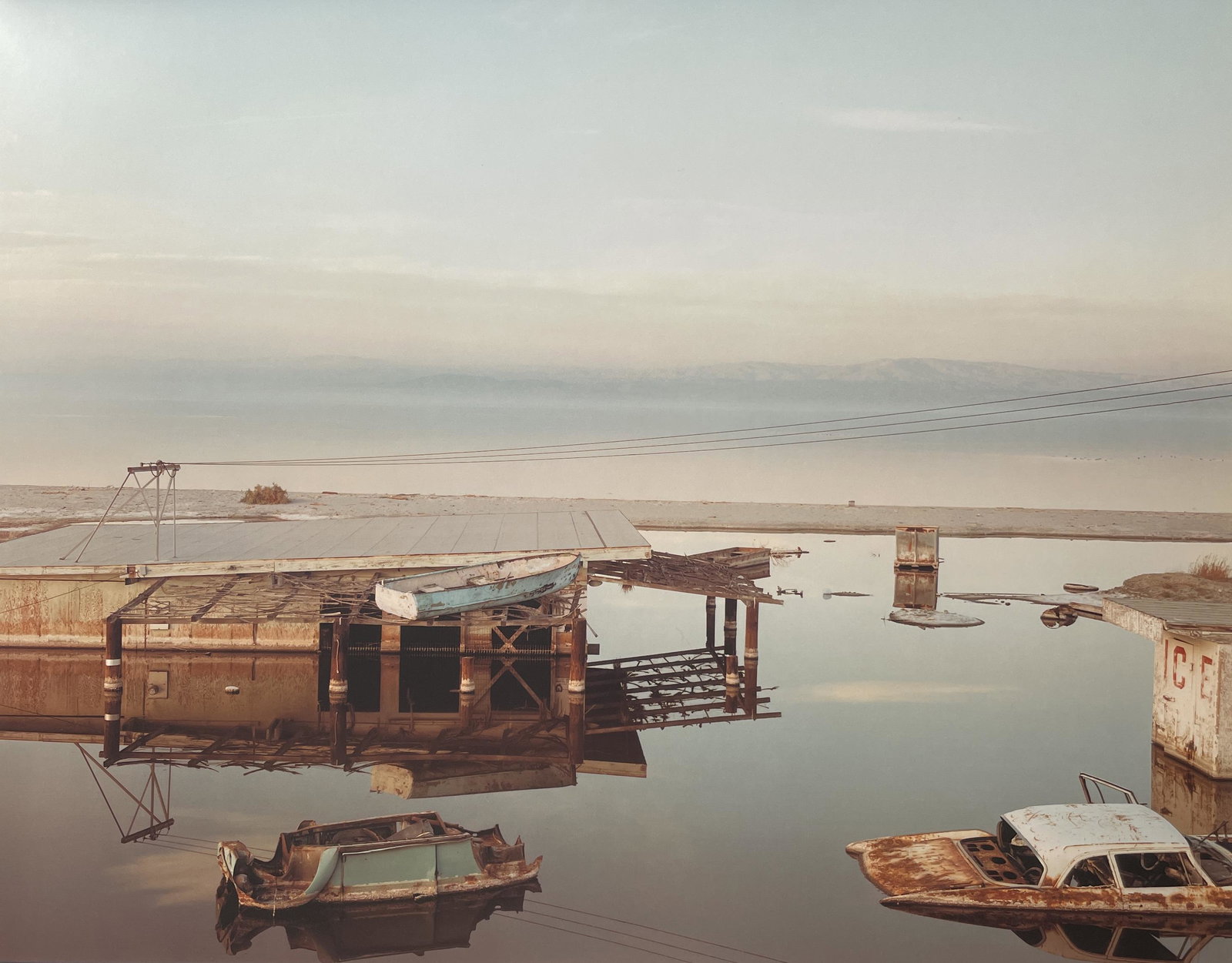 Richard Misrach "Stranded Rowboat, Salton Sea, 1983" Print: Richard Misrach "Stranded Rowboat, Salton Sea, 1983" Print. Measures 11.1 x 14.1. Mounted to Archival Quality Paper. Verso is blank. Printed circa 2000's.