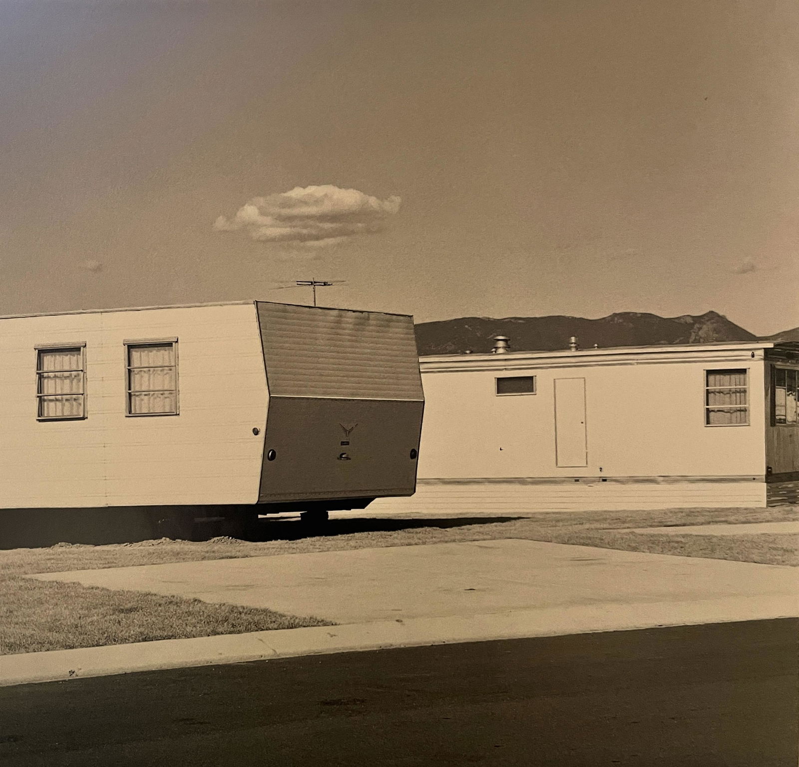 Robert Adams "Colorado Springs" Print: Robert Adams "Colorado Springs" Print. Measures 5.6 x 5.9. Mounted to Archival Quality Paper. Verso is blank. Printed circa 1970's.