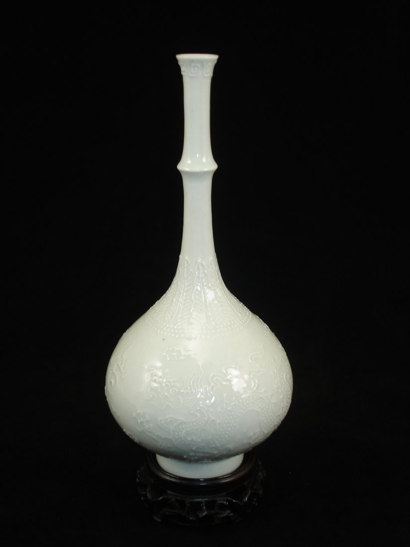 Fine white glaze long neck bottle: Fine white glaze long neck bottle, decorated with dragon and phoenix, Ht 7" Wood stand is not including. Shipping: We provide in house packing and shipping services at buyer's expense. The estimated s