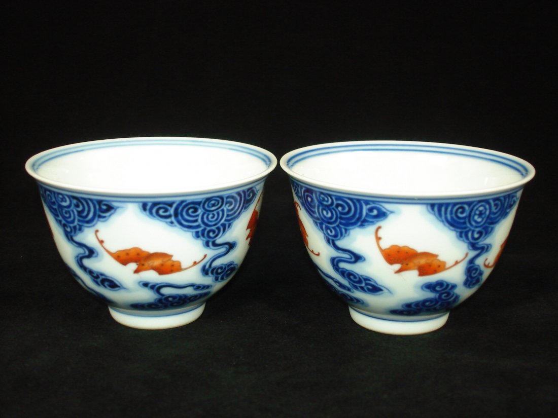 Pair of Chinese Porcelain Cups/Bowls with Bats & Clouds: Pair of Chinese porcelain cups/bowls with bats & clouds, both marked on base. Size: 3.6" D. 2.4" Ht. Condition: Good condition. (refer to pictures) Shipping: We provide in house packing and shipping s
