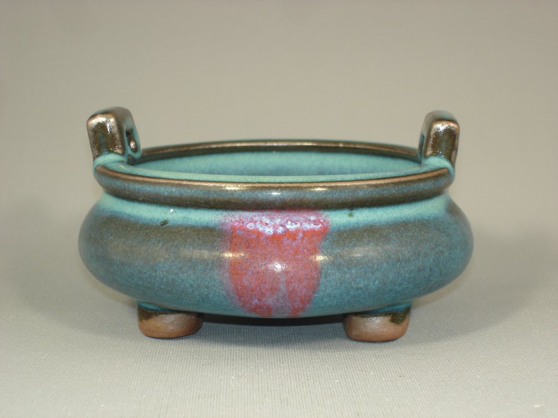 Song Style Jun Kiln Porcelain Tripod Incense Burner: Song style Jun kiln porcelain tripod incense burner with ears. Size: 4 1/2" D. 2 3/4" Ht. Condition: Good condition. (Refer to pictures.) Shipping: We provide in house packing and shipping services at