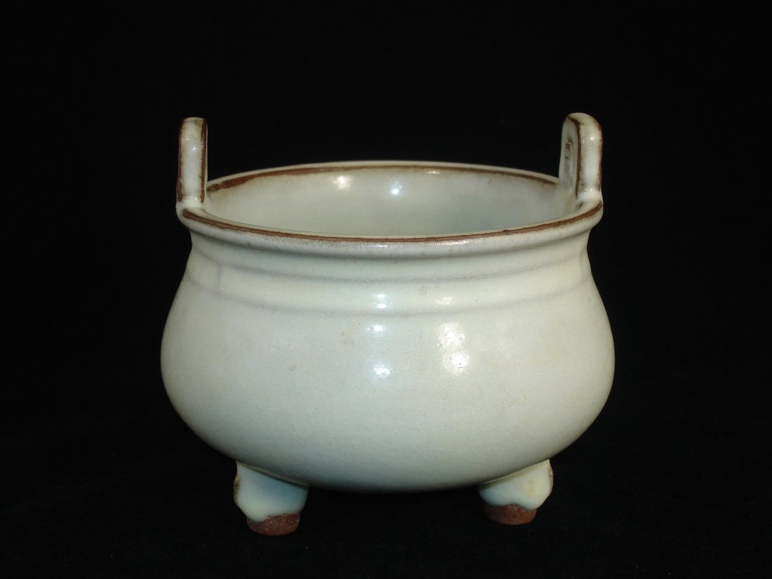 Chinese Guan Kiln Type Tripod Incense Burner with Ears: Chinese Guan kiln type tripod incense burner with ears. Size: 4 1/2" Ht. 4 3/4" W. Condition: Repaired on one ear otherwise in good condition. (Refer to pictures.) Shipping: We provide in house packin
