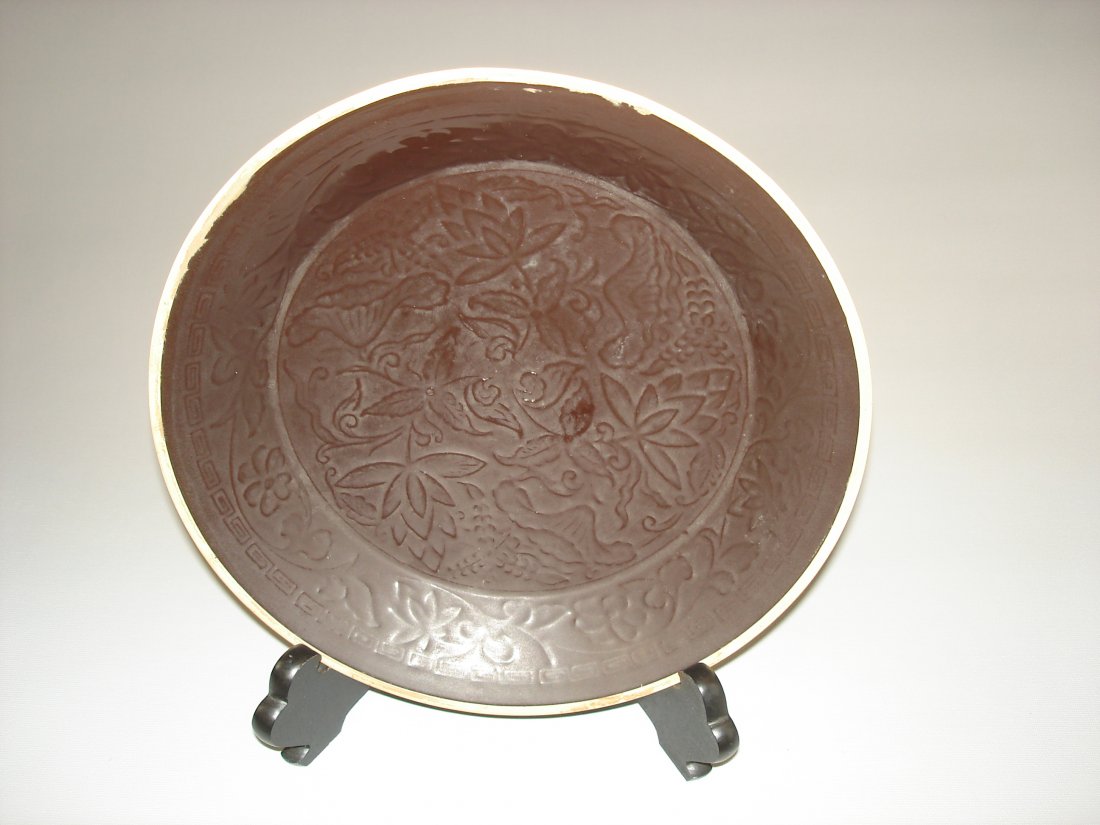 Chinese Ding yao style brown glazed plate: Chinese Ding yao style brown glazed plate, size: 8.5" D. Wood stand is not including. Shipping: We provide in house packing and shipping services at buyer's expense. The estimated shipping cost (exclu