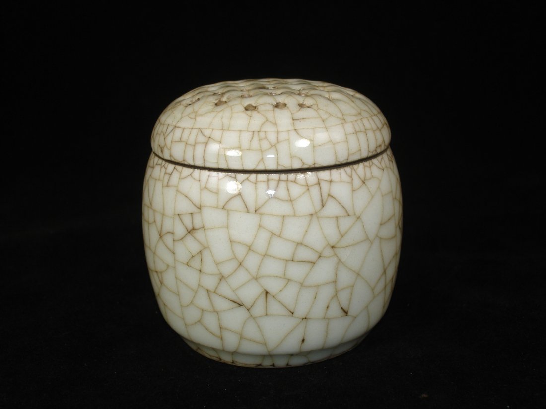 Ge Kiln Type Crackled Glaze Incense Burner with: Ge kiln tpye crackled glaze incense burner with apertured domed cover. Size: 2 3/4" W. 3" Ht. Condition: Slight stain on interior otherwise in good condition. (Refer to pictures.) Shipping: We provide