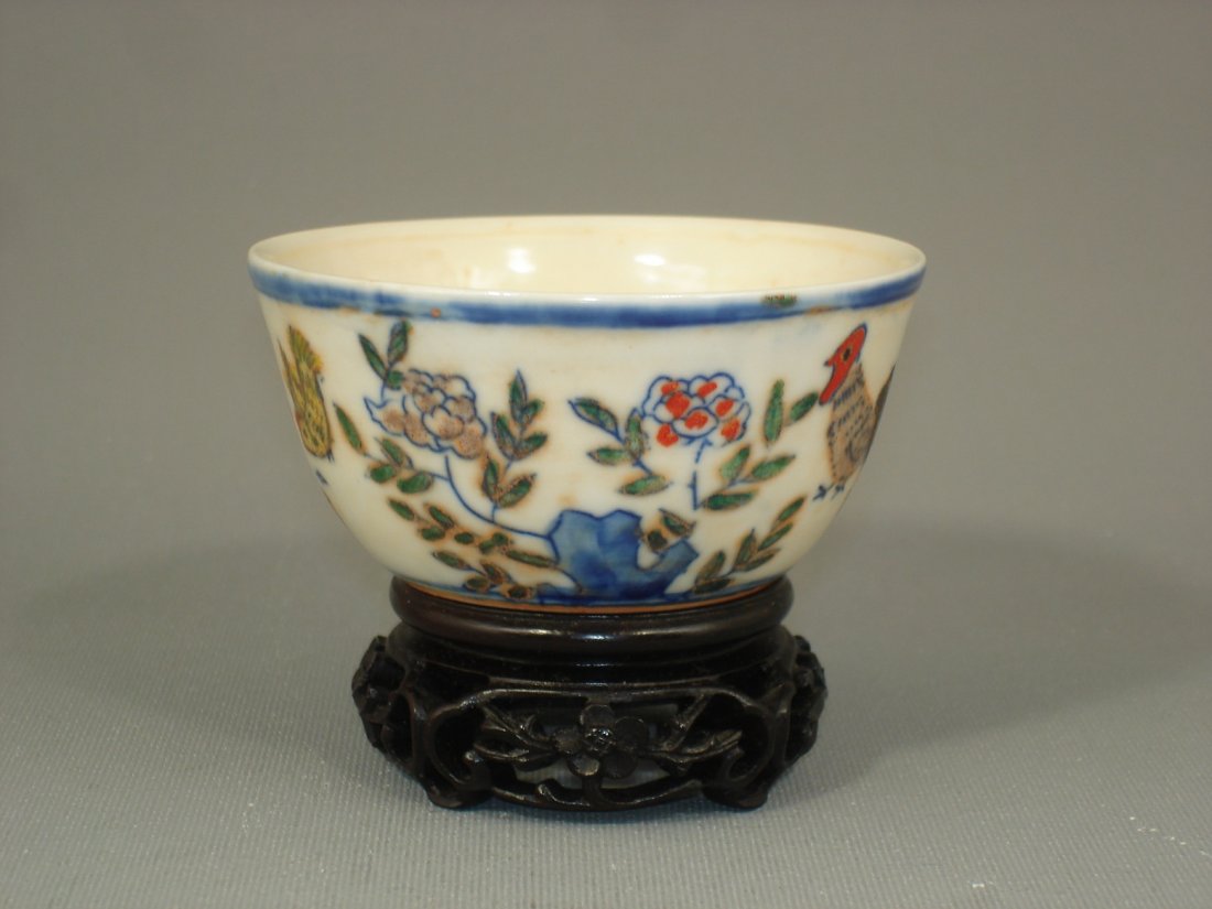 Chinese Dou-Cai Porcelain Cup Marked: Chinese dou-cai glaze porcelain cup, featuring in chickens and flowers, six-character mark on base. Size:3 1/8" D. 1 1/2" Ht. Condition: Good condition. (Refer to pictures.) Shipping: We provide in ho