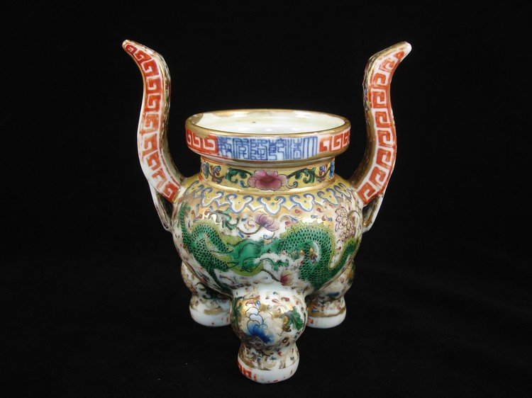 Qing Dynasty or Later Chinese Famillie Rose Tripod: Chinese procelain famillie rose tripod censer decorated with dragons and floral design, six-character mark on body. Size: 8" Ht. 6 1/2" W. Condition: Slight waer on surface otherwise in good condition