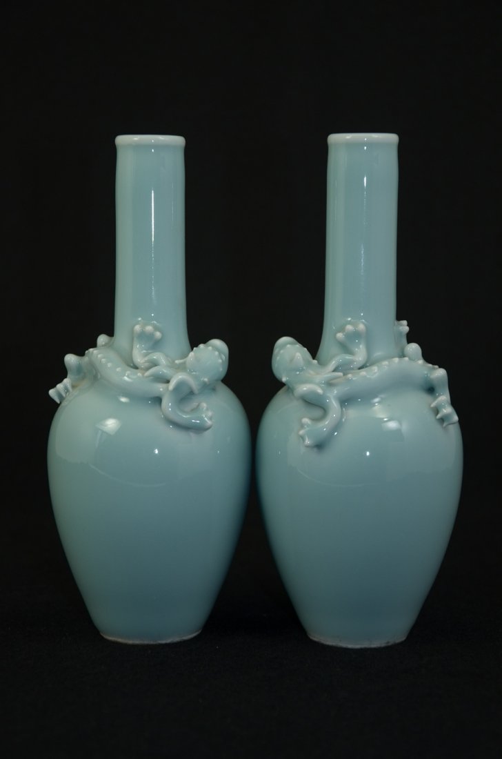 Pair of Chinese sky-blue glaze porcelain bottles with a: Pair of Chinese sky-blue glaze porcelain bottles, each bottle neck with a twined hornless dragon, six-character mark on base. Size: 7" Ht. 3" W. Condition: Good condition, refers to pictures. Shipping