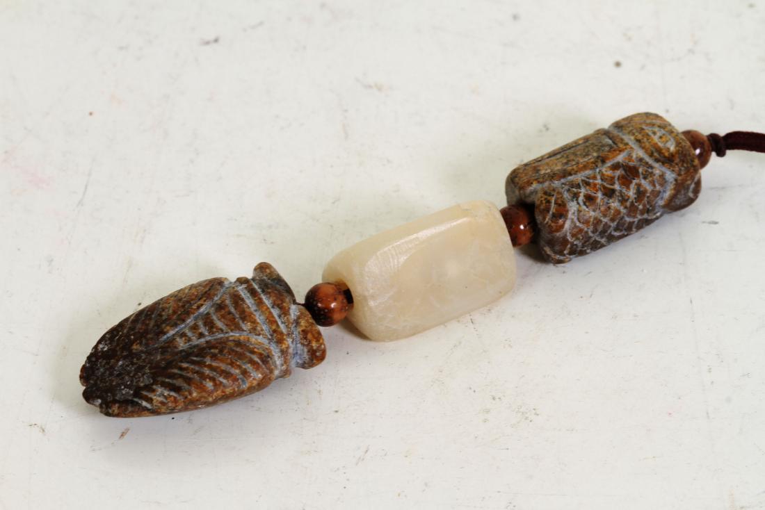 [CHINESE]A LATE 19TH CENTURY WHITE AND ANCIENT JADE (1 of 2)