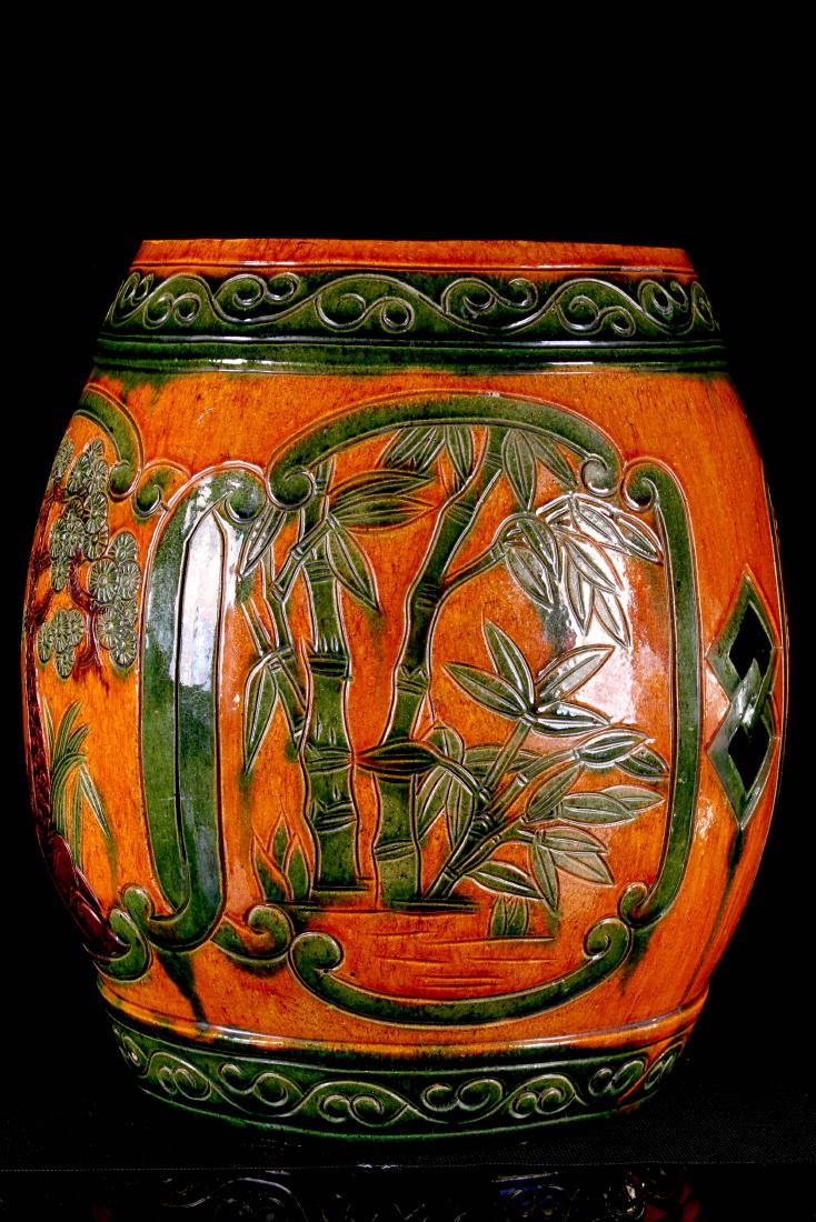 CHINESE YELLOW GLAZED PORCELAIN ROUND STOOL DECORATED: CHINESE YELLOW GLAZED PORCELAIN ROUND STOOL DECORATED WITH TREES AND BAMBOOS W:13" H:17"