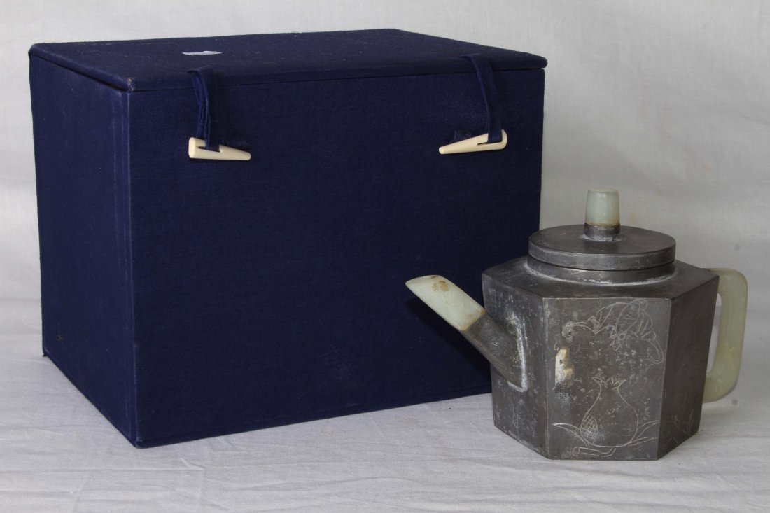 [CHINESE]A LATE 18TH CENTURY "FAN LV ZENG ZHI"MARKED: [CHINESE]A LATE 18TH CENTURY "FAN LV ZENG ZHI"MARKED YIXING GLAY TEA POT WITH TIN SHELLED AND JADE HANDLE L:7.5" W:5" H:5"十八世纪后“范绿曾制