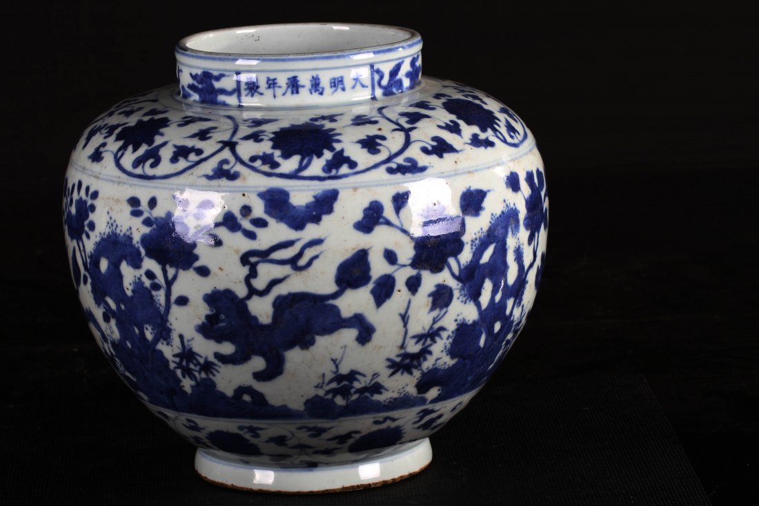 [CHINESE]A "DA MING WAN LI NIAN ZHI"MARKED BLUE AND: [CHINESE]A "DA MING WAN LI NIAN ZHI"MARKED BLUE AND WHITE JAR PAINTED WITH FLOWERS AND LIONS W:8.25" H:9.5"大明万历年制款青花狮子Ŏ
