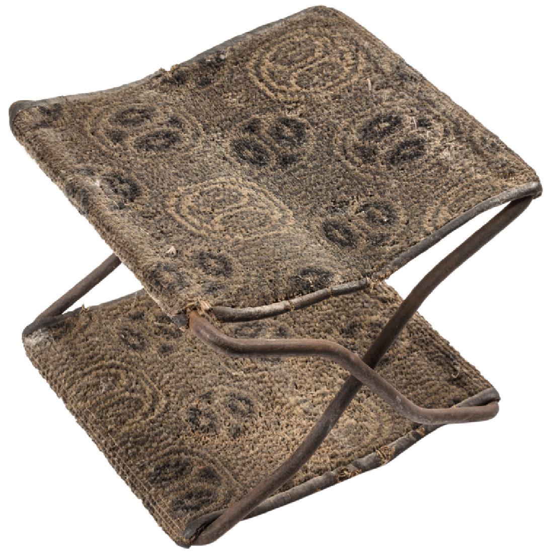 c1895 Indian Wars Army Officer Camp Travel Stool: Western America c. 1895 Indian Wars Original Army Officer’s Camp Stool c. 1895 Later Indian Wars / Spanish American War Era, Officer’s Hand-Sewn Carpetbag material Folding Camp Stool, Very Fine. c
