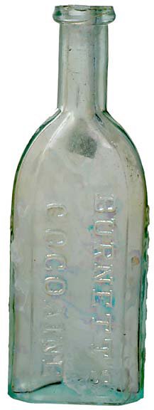 Original BurnettÕs Cocoaine Bottle: Original "Burnett's Cocoaine" Glass Bottle. c. 1860, 6" high, light clear green glass, Choice Extremely Fine. According to Fred Reed, Burnett's Cocoaine had "...nothing to do with the cocaine, the dru