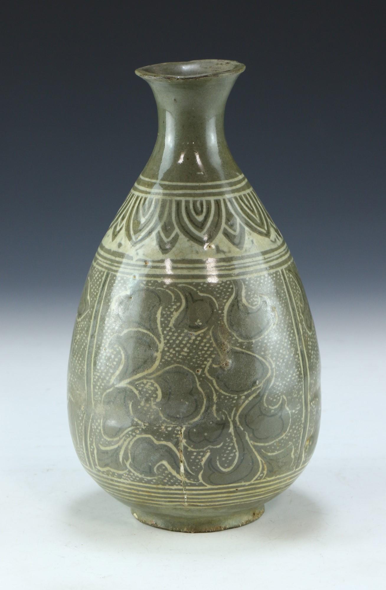 A KOREAN CELADON GLAZED PORCELAIN VASE: A Korean Celadon Glazed Porcelain Vase: Of Ovoid Form, Rising From A Base Rested On Low Feet To A Slim Neck And Splayed Rim, Body Finely Painted With Lush Leaf Scene Panels; Size: H: 9" (22.86cm)