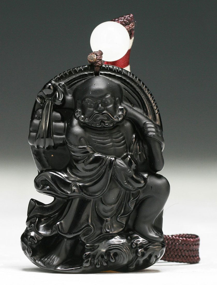 A Chinese Antique Carved Obsidian Pendant: A Chinese Antique Carved Obsidian Pendant; Dimension: H: 2-1/2"