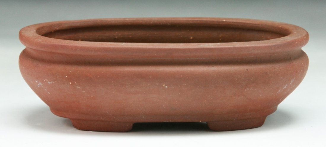 A Chinese Yixing Zisha Pot: A Chinese Yixing Zisha Pot; Dimension: L: 3-3/4"